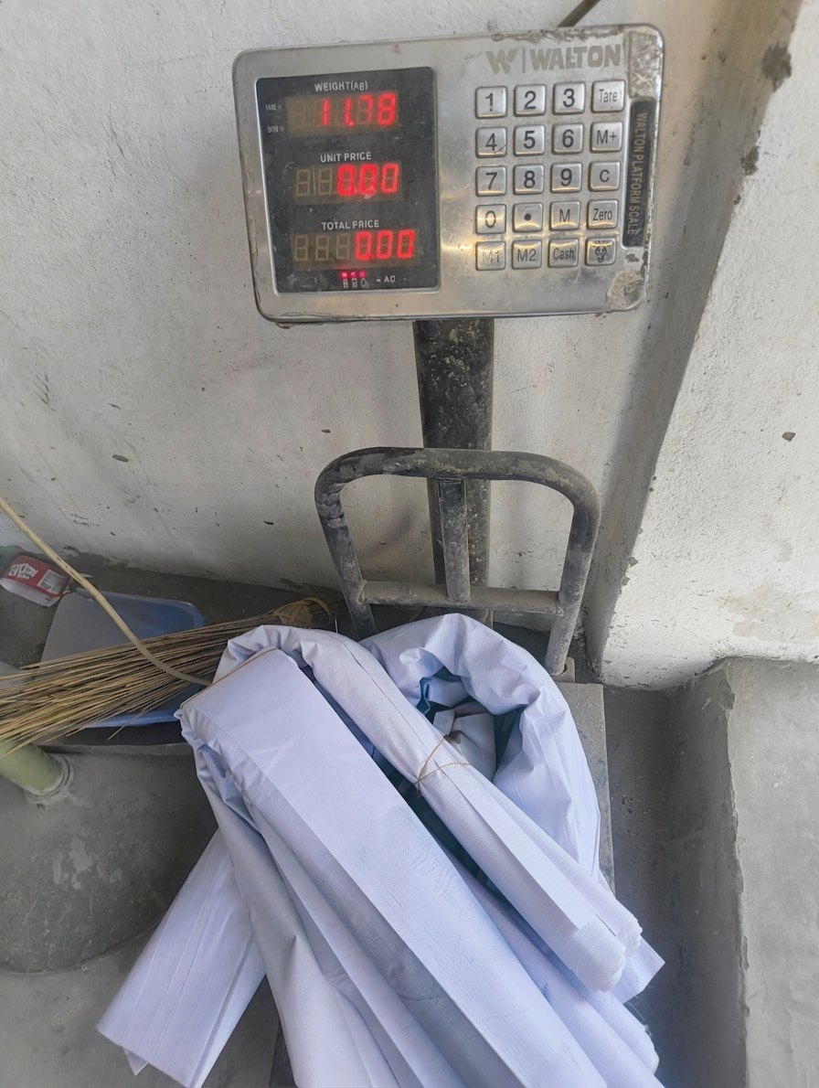 Collected banners on a scale reading 11.78 kg